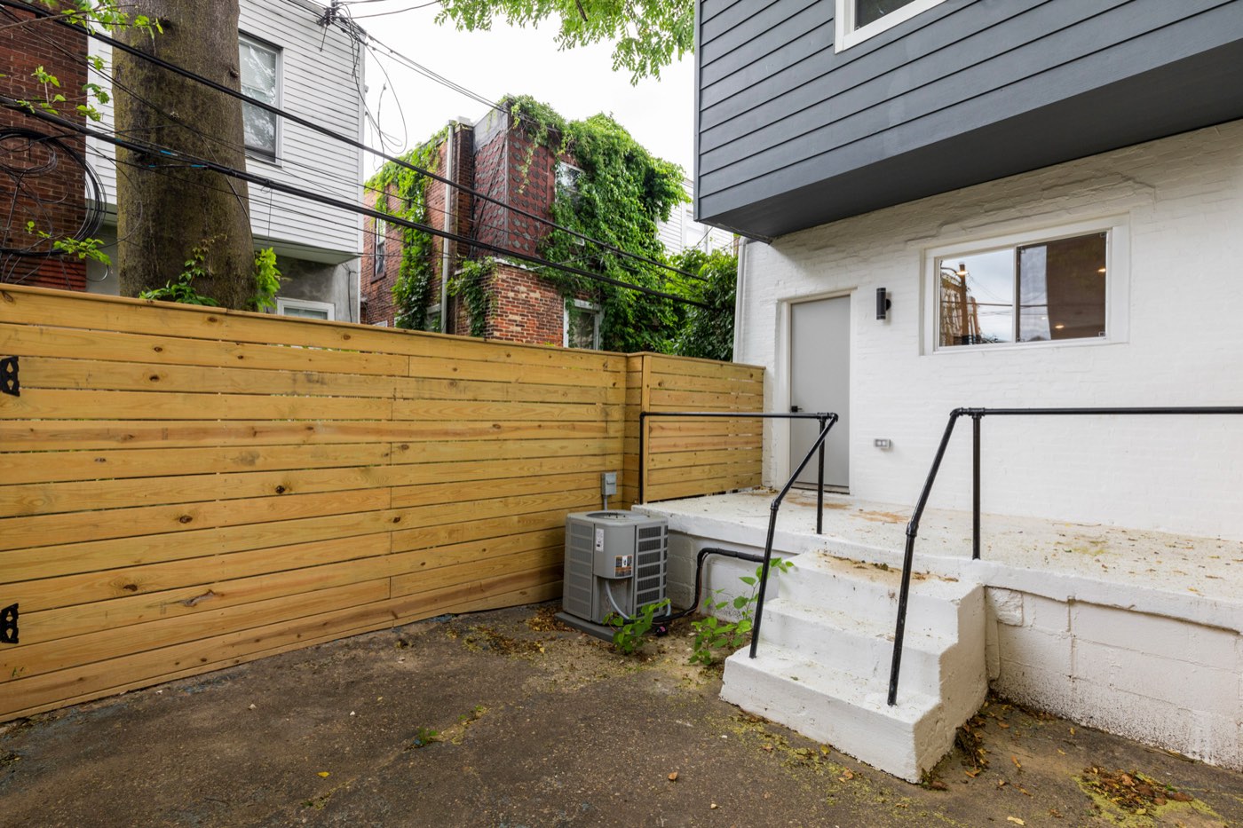 Fenced backyard at 710 S Frazier St after renovation